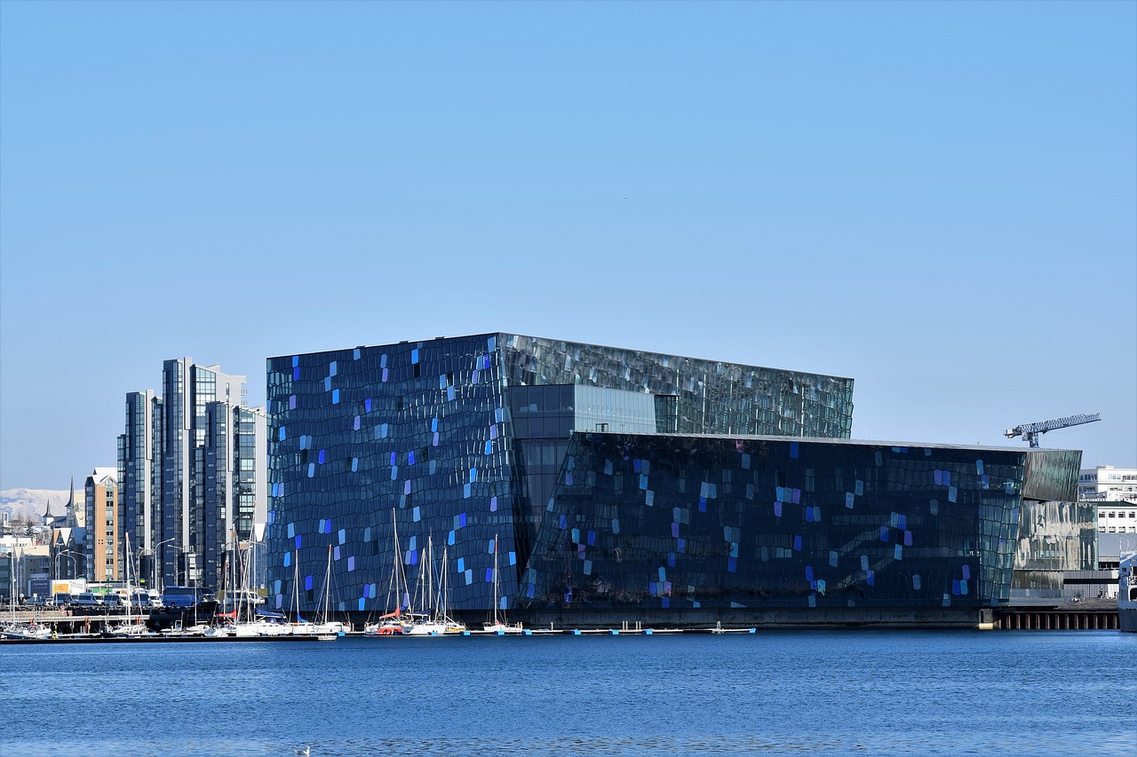 a building with many windows and a body of water