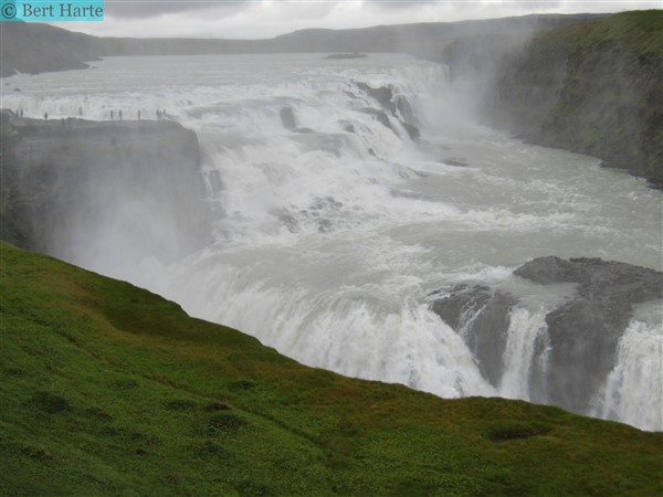 Gullfoss with a green hill