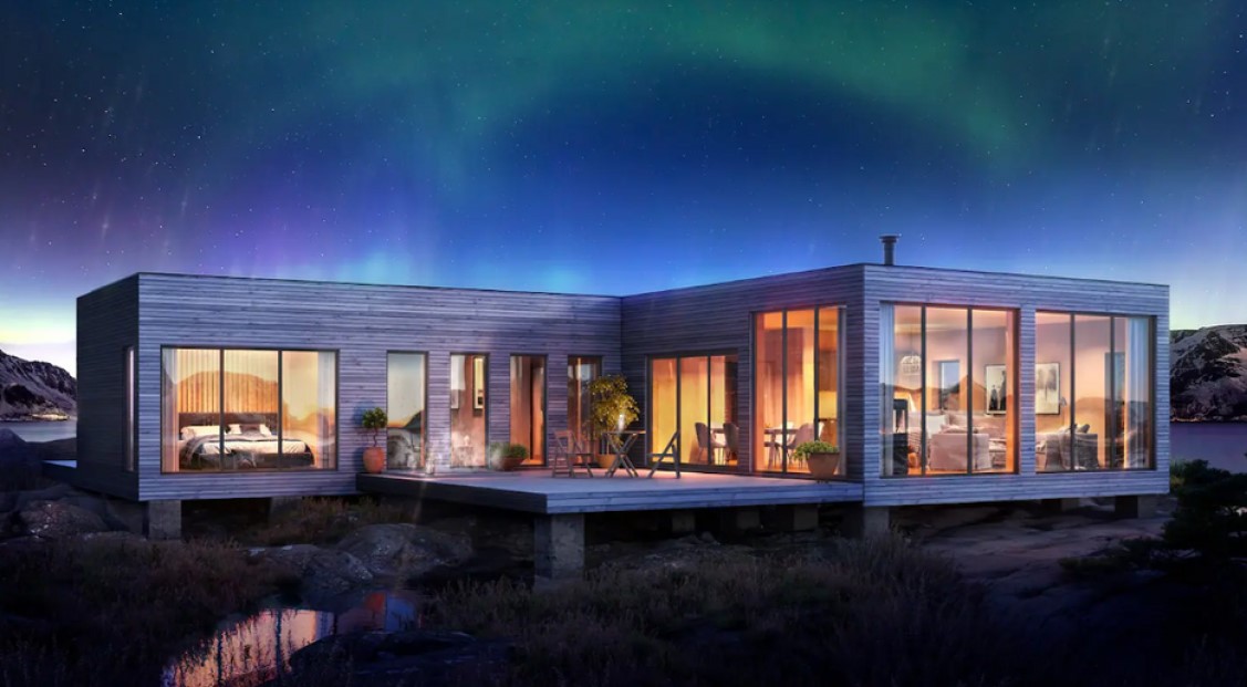 Een luxe hut aan het water met noorderlicht erboven